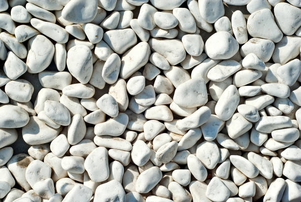 istock Drainage systems from small pebbles. Garden drainage for plants and trees. White stones for roads and flower beds. 1267028784