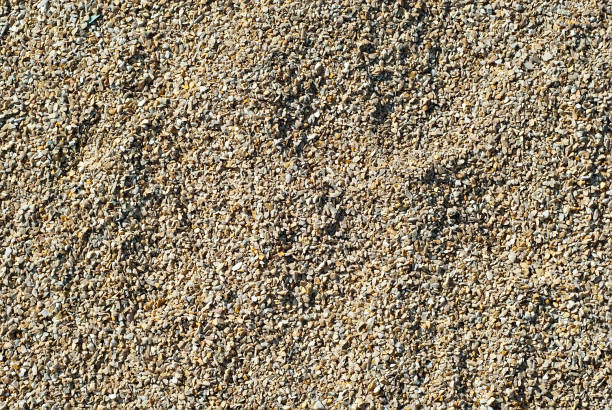 istock Drainage systems from small pebbles. Garden drainage for plants and trees. Yellow stones for roads and flower beds. 1267028789