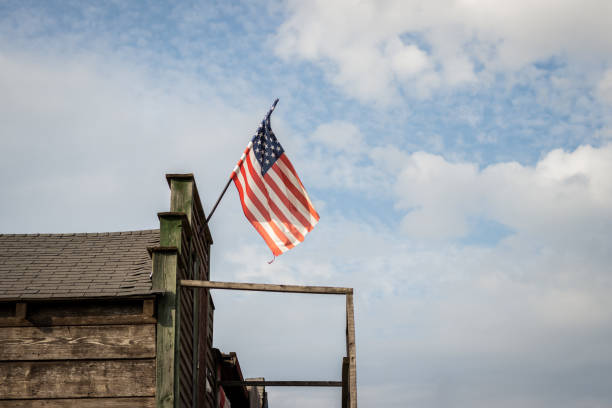 istock American flag on wooden building 1267028919
