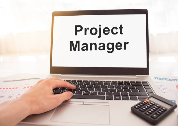 istock laptop with words Project on white screen, business and finance concept. 1267029140