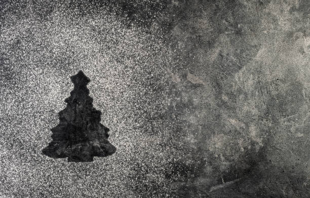 fir tree made from flour on a dark table stock photo