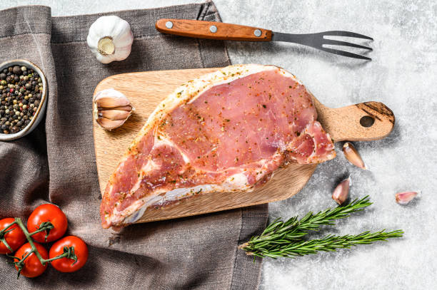 istock Marinated pork steak cutlet. Gray background. Top view 1267030017