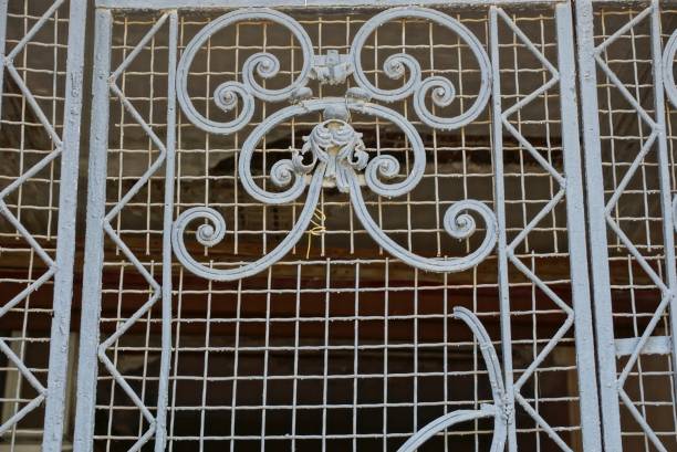 istock gray metal texture from an old iron grating with a forged pattern in the wall 1267030450