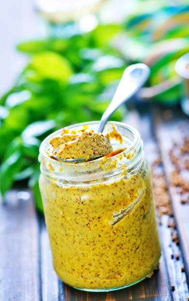 mustard mustard in glass bank and on a table dijonnaise stock pictures, royalty-free photos & images