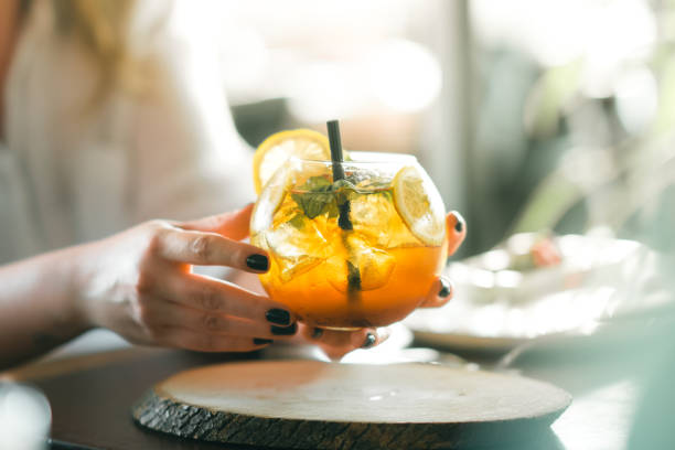 istock Woman hand holding iced cocktail 1267037961