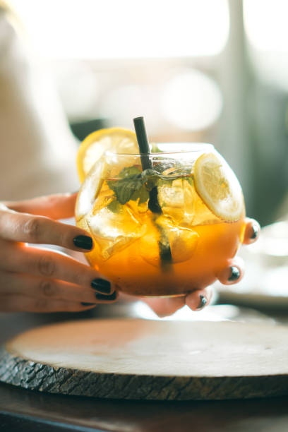istock Woman hand holding iced cocktail 1267037963