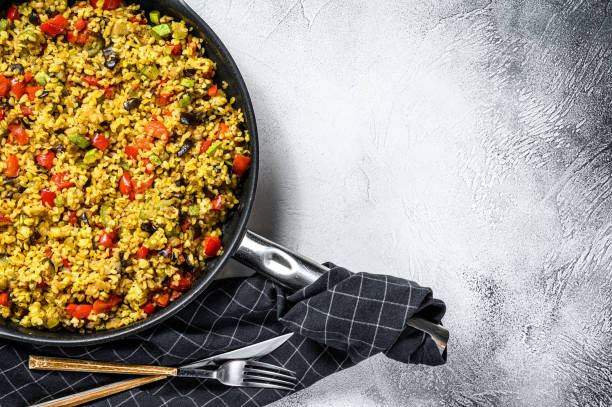 istock Cooked bulgur with vegetables and chicken meat in a pan. Gray background. Top view. Copy space 1267039014