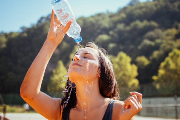 istock Young woman tennis player drinking water 1267039147