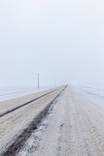 istock dirty snow on the road 1267039222