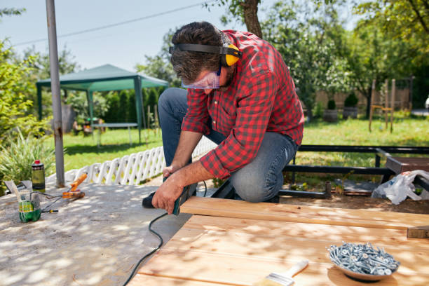 istock Carpenter with protective eyewear and ear muffs working with an electric sander 1267039258