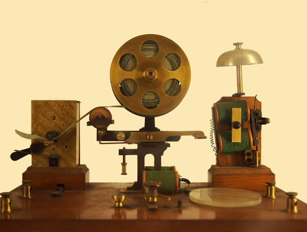 vintage effect image of an old morse code telegraph machine with bell and brass printer