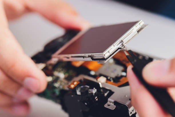 istock Repairing digital single lens reflex camera, isolated. 1267047686