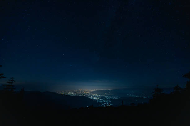 istock night city from mountain in japan 1267048218