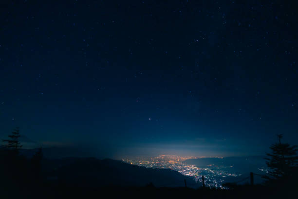 istock night city from mountain in japan 1267048231