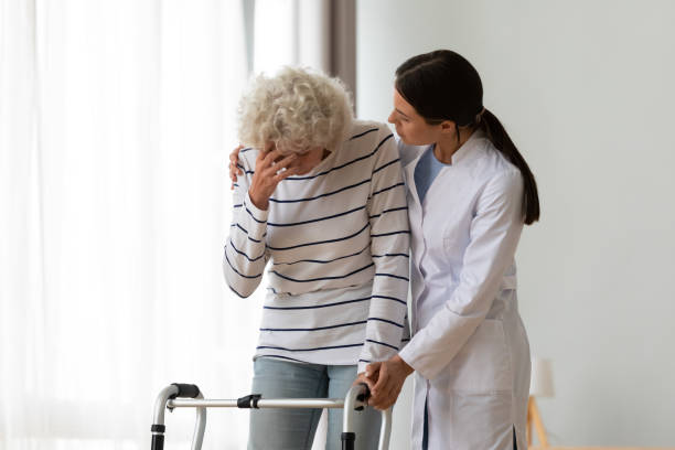 istock Professional female physiotherapist supporting depressed disabled woman. 1267049018