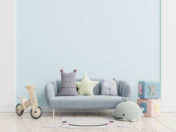 istock Blue sofa and doll,cute pillows in elegant child's room with mockup wall. 1267052326