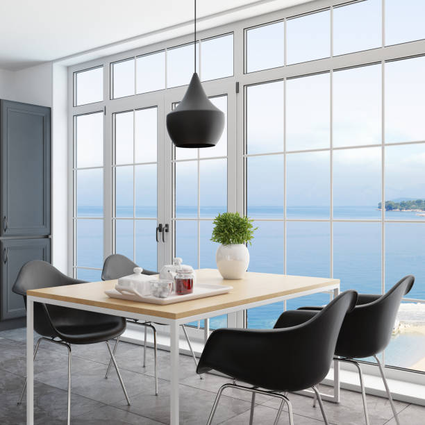 istock Modern Scandinavian kitchen and dining room with matte black traditional cabinet design 1267056681