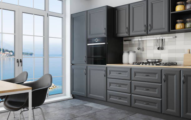 istock Modern Scandinavian kitchen and dining room with matte black traditional cabinet design 1267057595