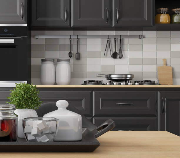 istock Modern Scandinavian kitchen and dining room with matte black traditional cabinet design 1267057637