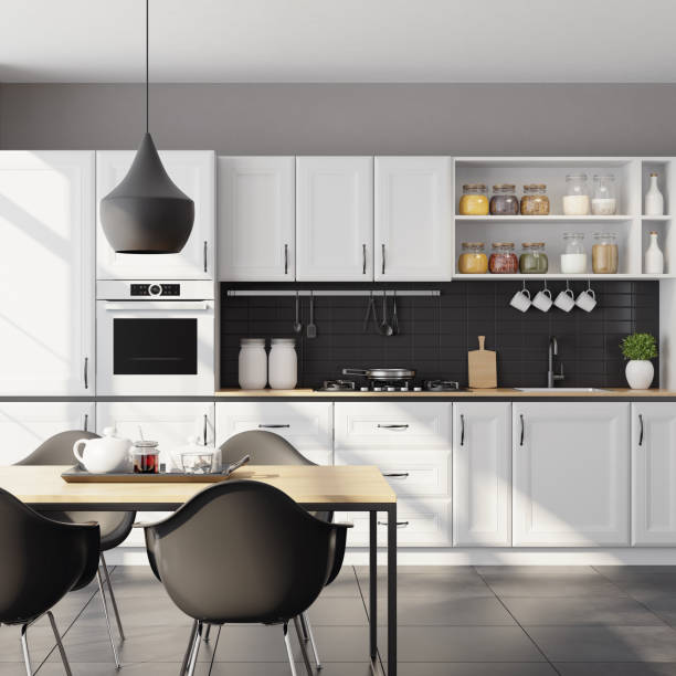 istock Modern Scandinavian kitchen and dining room with matte white traditional design cabinets 1267058577