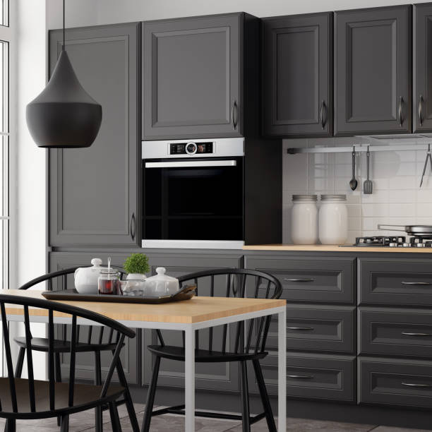 istock Modern Scandinavian kitchen and dining room with matte black traditional cabinet design 1267060079