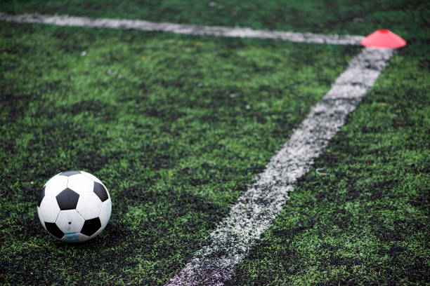 istock Training Ball in green soccer field 1267062654