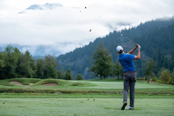 istock Man hits a great golf shot towards the fairway 1267065699