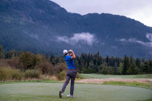 istock Man hits a great golf shot towards the fairway 1267065744