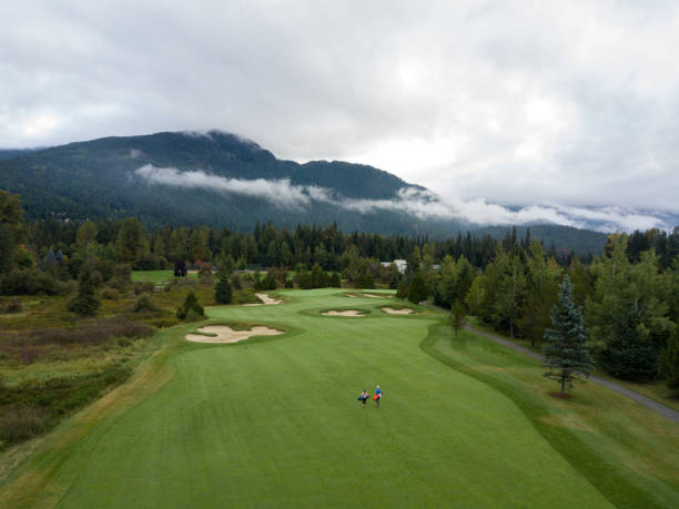 istock Golfers walking down the fairway 1267066851