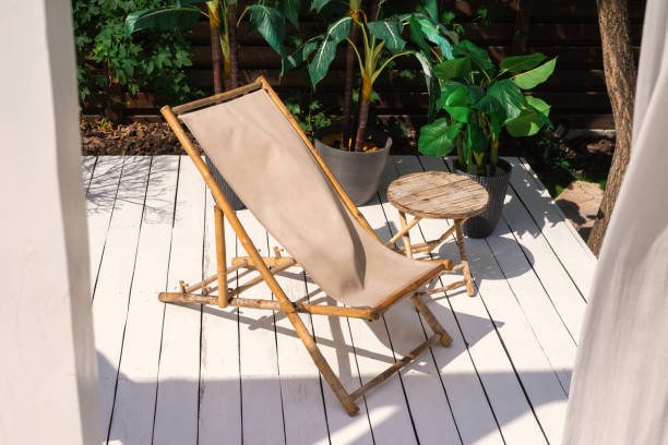 istock Comfortable bamboo chair and table, plants outdoor. 1267074762
