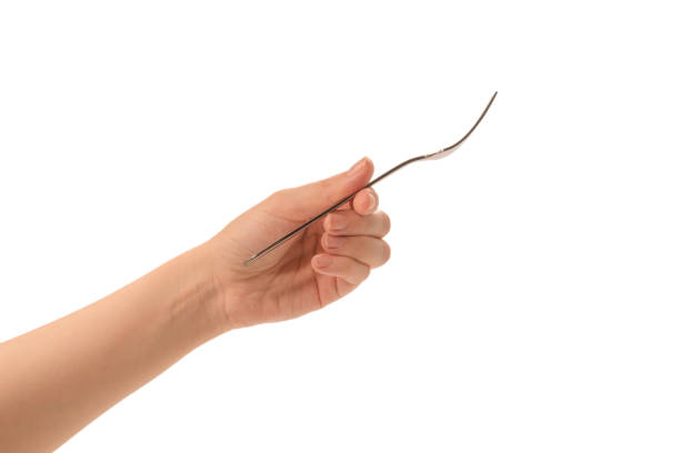 istock Fork in woman hand isolated on white. 1267074789