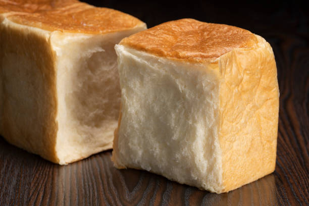 Shred freshly baked bread by hand
