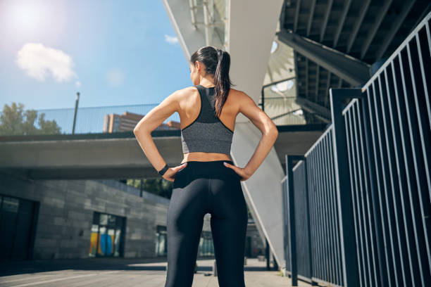 istock Back view of sporty girl that looking forward 1267076730
