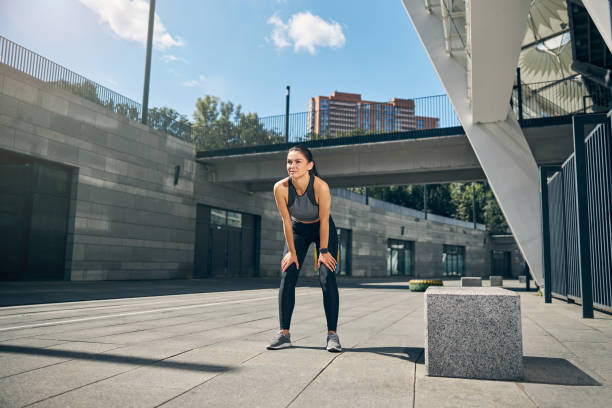 istock Attractive young brunette woman preparing for running 1267076735