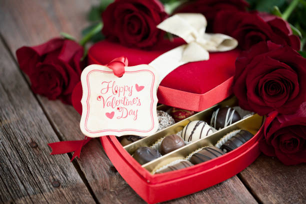istock Valentine's Day Box of Chocolates and Red Roses 1267076767