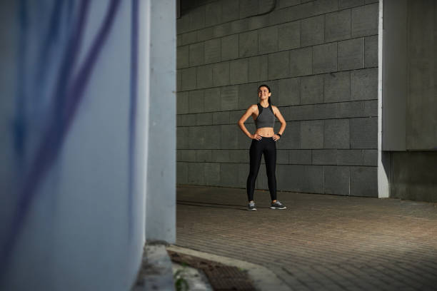 istock Active young female person having pause during running 1267077385