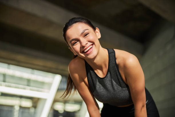 istock Kind brunette sportswoman posing on the camera 1267077415