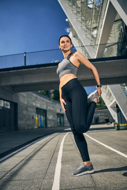 istock Positive delighted young female doing sport outside 1267077456
