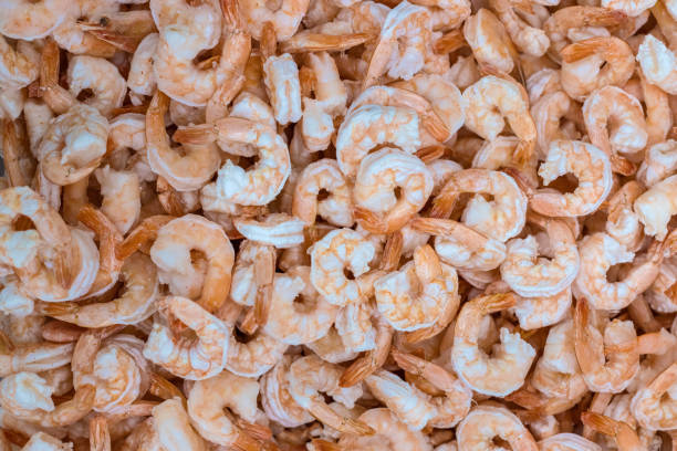 istock Raw peeled frozen shrimps. 1267081433