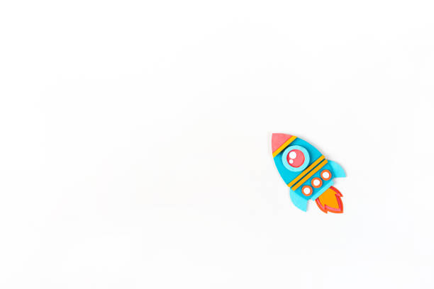 istock Rocket paper craft. Back to school education. White background 1267083819