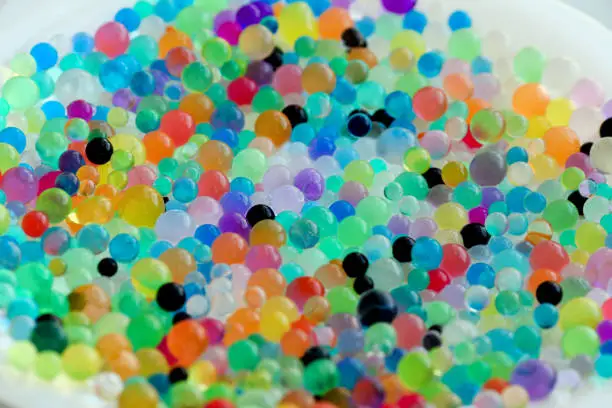 Close up background of hydrogel water balls - orbiz. Colorful orbeez