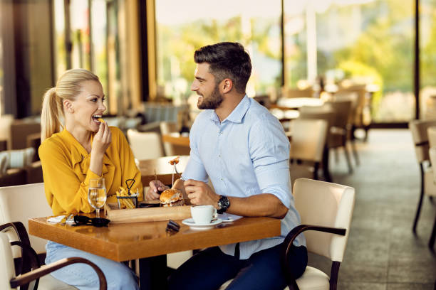 istock Smiling couple communicating during a lunch in a restaurant. 1267086027