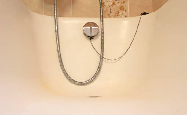 istock Old bathroom, brown tiled interior with bathtub 1267092491