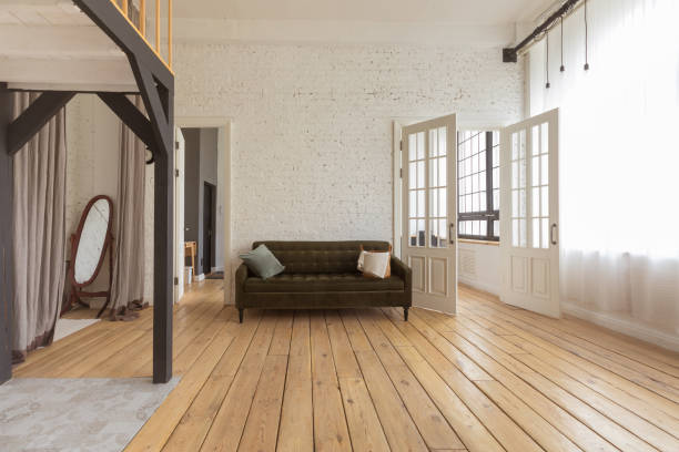 Wide shot of an empty apartment with newly installed oak floors