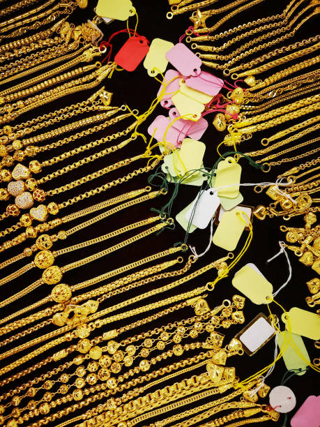istock Solid gold bracelets on a counter for sale in a gold shop. 1267099199