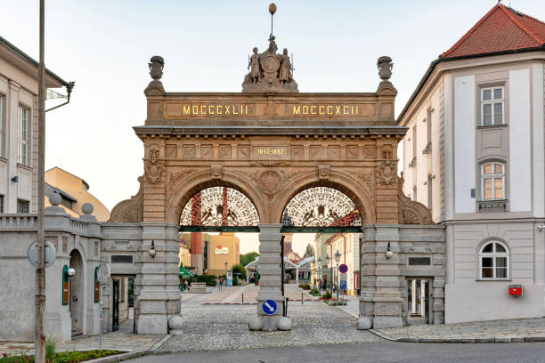 Pilsner Urquell Brewery Main Gate Pilsen, Czech Republic - August 8, 2020: View of the historic Pilsner Urquell brewery main gate. The picture was taken at sunset. Pilsen is famous for being the birthplace of the Pilsner beer style. pilsen stock pictures, royalty-free photos & images