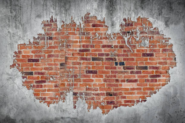 istock Old brick wall with peeling mortar grunge concrete weathered  wall background 1267103556