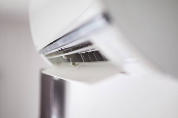istock Air conditioner on white wall room interior background 1267103812
