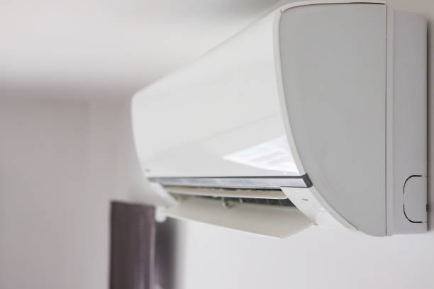 istock Air conditioner on white wall room interior background 1267103816