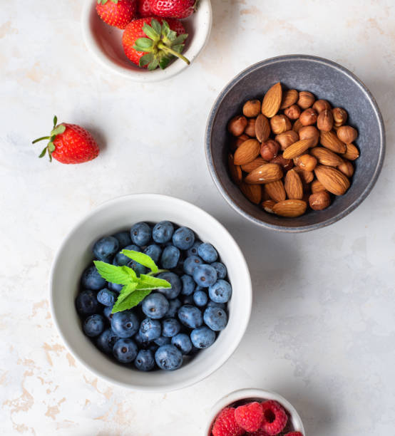 istock Healthy diet. Useful ingredients. Delicious summer berries. Useful nuts. 1267103925